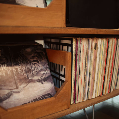 A close up of the bookshelf style vinyl record storage in the WickerWoodWorks Irving Turntable station and vinyl record storage furniture.
