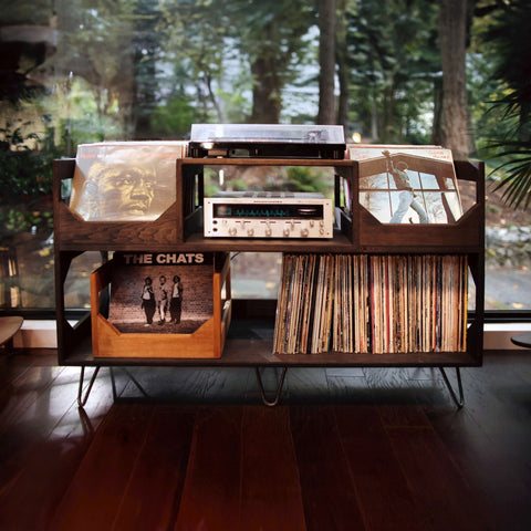 The irving turntable station by wickerwoodworks sits as a centerpiece in the living room of a mid century modern home