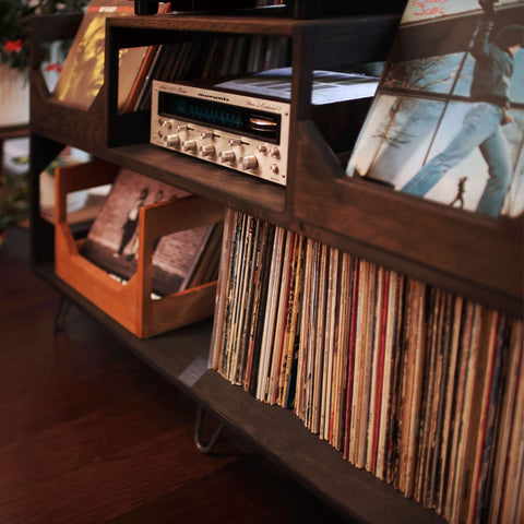 A Close up of the Irving Turntable station in dark walnut showing the amp cubby with a vintage marantz amp